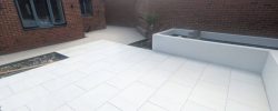 Paved terrace with raised planting borders