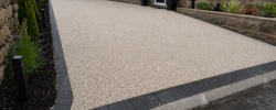 Modern stone house with resin driveway
