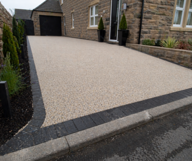 Modern stone house with resin driveway