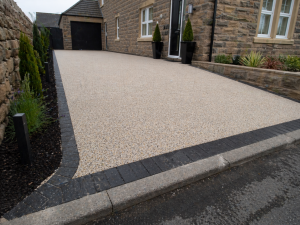 Modern stone house with resin driveway
