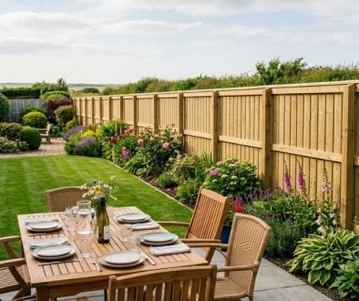 A freshly installed timber fence running along the edge of a tidy North East back garden on a bright summer afternoon
