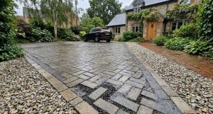 Permeable block-paved front driveway with visible gaps between blocks and a gravel border