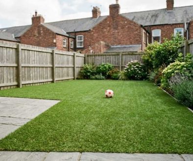 Neatly installed artificial grass lawn in an enclosed Newcastle back garden