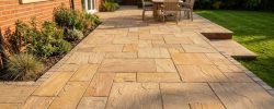 Riven Indian sandstone patio laid beside a red-brick North East home