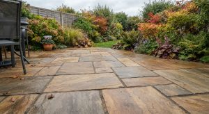 Laid Indian sandstone patio showing natural colour variation and riven texture