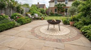Fire bowl on a dedicated gravel and fire brick pad within a patio