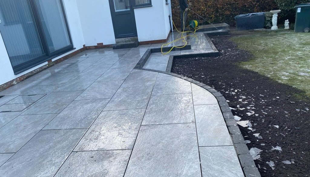 Garden patio with curved edging and steps