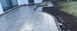 Garden patio with curved edging and steps