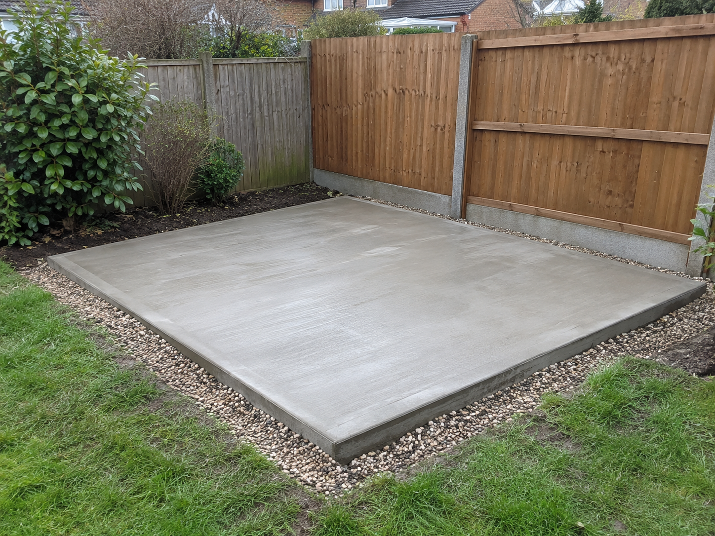 AI illustration: Concrete shed base in a residential garden